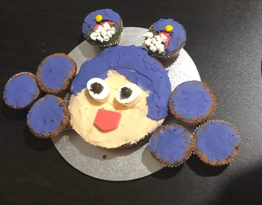 Red velvet cupcakes decorated as a character for a birthday party